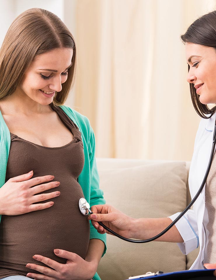 Midwife Examining Pregnant Woman 1 Midwife Examining Pregnant Woman 1